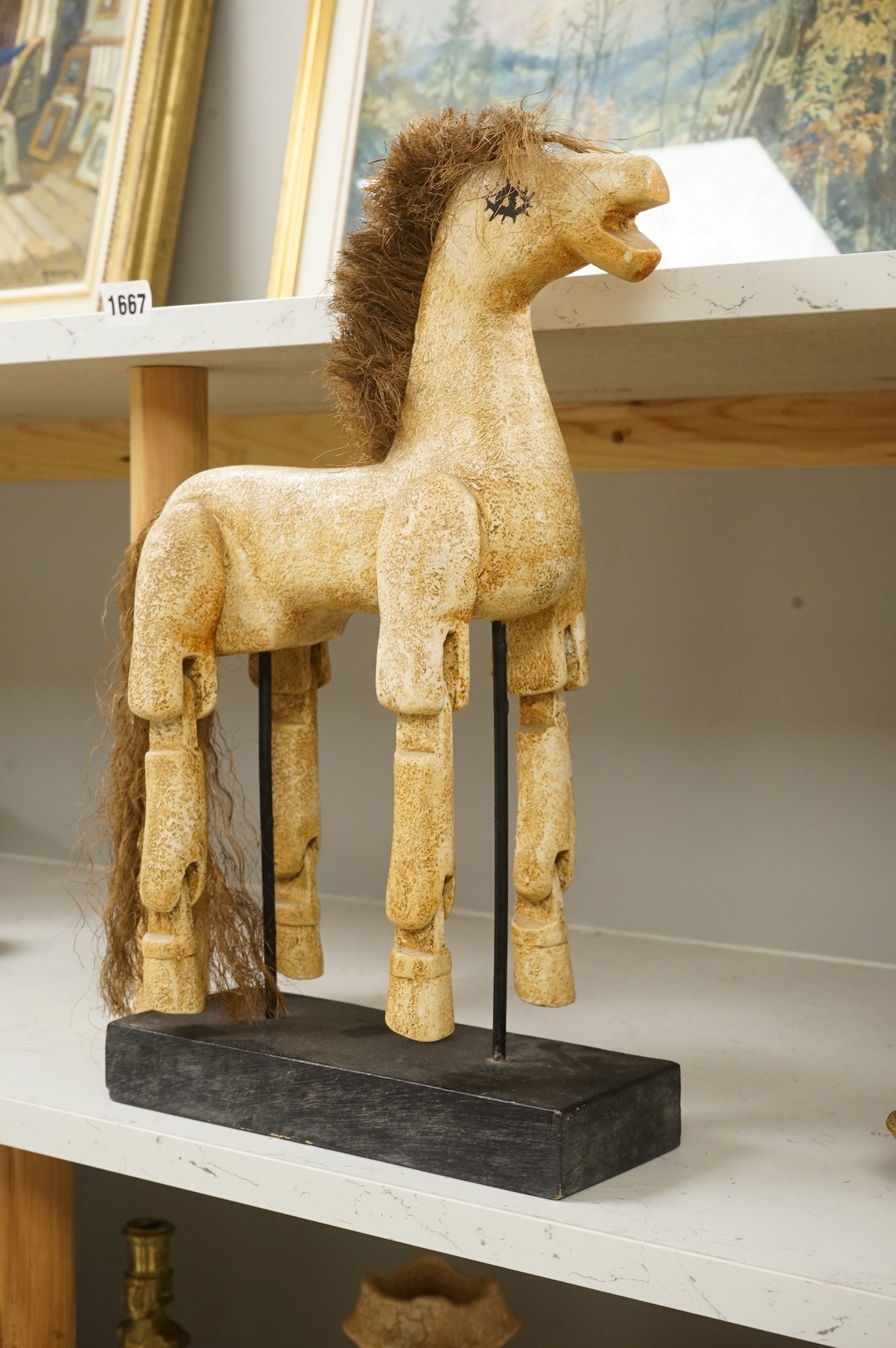 A painted composition articulated model horse, on stand, 42cm